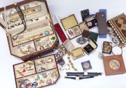 A collection of costume jewellery including brooches, necklaces, nephrite jade pendant, thistle