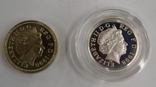 1998 £1 coins comprising a silver piedfort and a standard issue, early strikes produced for the