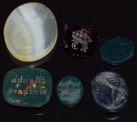 Five intaglios carved from bloodstone, agate, garnet, and glass