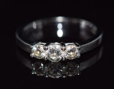 An 18ct white gold ring set with three diamonds, total diamond weight approximately 0.5cts, 3.2g,