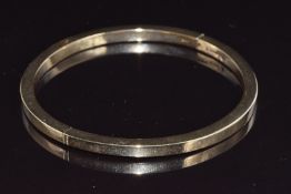 A 9ct gold bangle, 16.2g