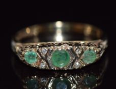 A 9ct gold ring set with emeralds and diamonds, 2.5g, size L