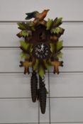 A c1970s two train cuckoo clock in painted case, with two weights, H22cm