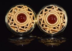A pair of 14ct gold earrings set with agate in a pierced setting, 7.2g