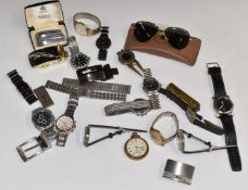 A collection of watches, Ronson lighter, vintage Ray-Ban sunglasses, belt buckles for Jaguar, Gucci,