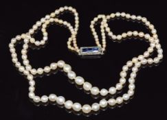 Two strand pearl necklace (mixture of cultured and natural pearls) with a white gold clasp set