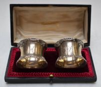 Edward VII Mappin & Webb cased pair of hallmarked silver napkin rings, London 1907, maker Josiah