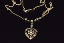 A 9ct gold necklace set with seed peals and peridot, 7.1g