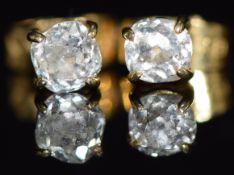A pair of 18ct gold studs set with an old cut diamond of approximately 0.2ct to each