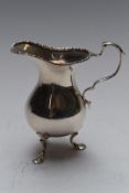 George V hallmarked silver milk jug, raised on three feet, London 1920, maker Charles Edwards,