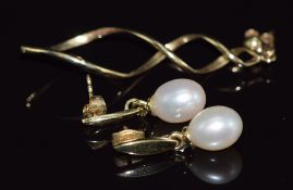 A pair of 9ct gold earrings set with a pearl to each and a 9ct gold earring, 5g