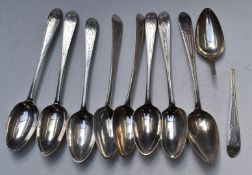Nine Georgian Irish hallmarked silver table spoons with bright cut decoration, four Dublin 1782, two