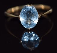 A 9ct gold ring set with an oval cut blue topaz, 1.4g, size L/M