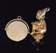 A 9ct gold charm in the form of a lucky pixie and a 9ct gold swivel pendant reading 'I Love You',