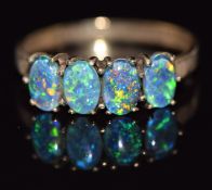 A 9ct gold ring set with four opal triplets, 2.1g, size O