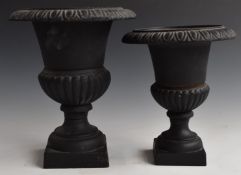 Two cast iron campana urns, height of taller 26cm