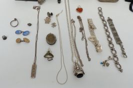 A collection of silver jewellery including pendant set with amber, locket, cigarette case, ring with