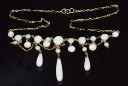 A c1900 9ct gold necklace set with round cut opal cabochons and teardrop opals, 6.5g, 44cm long