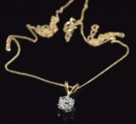 An 18ct gold pendant set with an old cut diamond of approximately 0.6ct, on 9ct gold chain, 1.5g