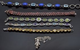 Two silver bracelets including one set with lapis lazuli & topaz and one with garnets together