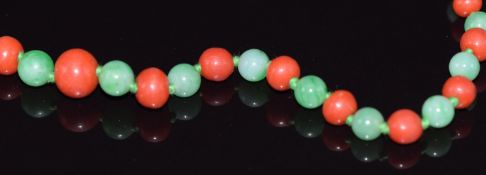 A jadeite and coral beaded necklace, 48cm long