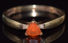 A 9ct gold ring set with a trilliant cut fire opal and diamonds, 1.9g, size O