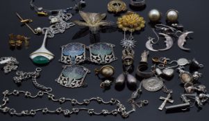 A collection of silver jewellery including earrings, necklace, filigree brooches,
