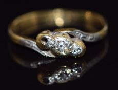 An 18ct gold ring set with diamonds in a twist setting, 1.8g, size J/K
