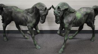 A handed pair of bronze horses, for garden or similar display, L120cm, H105cm