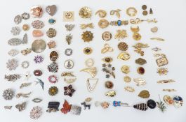 A collection of jewellery including silver rings, Hollywood brooch, Czech buckle, Miracle pendant,