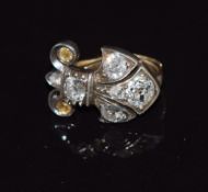 Victorian clip in the form of the fleur de lis set with old cut diamonds, the largest