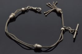 A white metal watch chain with acorn shaped beads and tassel charm, marked 800, 26cm