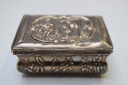 19thC Continental white metal hinged snuff box with relief decoration of figures and hunting dogs,