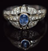 An 18ct white gold ring set with a sapphire and diamonds, 6.1g, size N