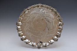 Victorian hallmarked silver salver with shaped rim, raised on three shell feet, London 1866, maker