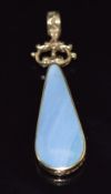 A 9ct gold pendant set with blue lace agate, verso faux sunstone, 4.5 x 1.1cm