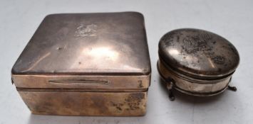 A hallmarked silver cigarette box, Birmingham 1904, maker Percy Whitehouse, width 10cm and a