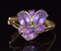 A 9ct gold ring set with oval and round cut amethysts, 2.7g, size P