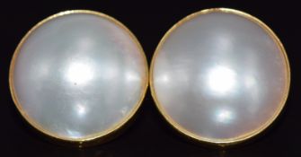 A pair of 18ct gold earrings set with a Mabe pearl to each