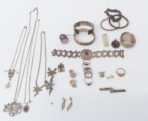 A collection of silver jewellery including ring, bracelets, bangles, chains, brooches, etc