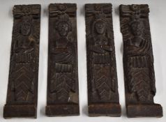 Four antique carved oak figural panels or caryatids with coats of arms below, 42x9.5cm