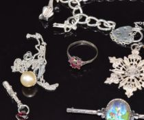 A collection of silver jewellery including charm bracelet, Wedgwood earrings, silver brooches, etc