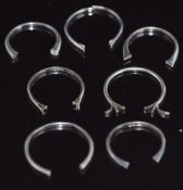 A collection of white metal sections of ring band, 9.5g
