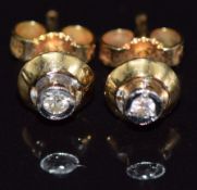 A pair of 18ct gold earrings set with diamonds, 2.1g