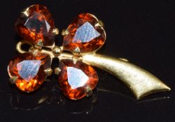 An 18ct gold brooch in the form of a four leaf clover, set with citrines, 3.3g, 2.5 x 1.4cm