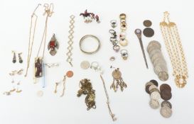 A collection of costume jewellery including Miracle pendant, silver rings, coins, necklaces, etc