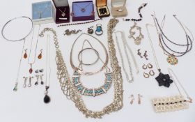 A collection of silver jewellery including necklaces, rings, bracelets, etc