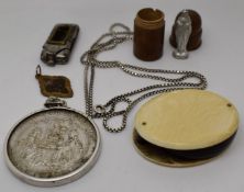 An ivory loupe, religious pendant, St Christopher, turned wooden pot opening to reveal a religious