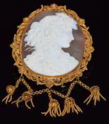 A c1860 gold filigree brooch set with a large cameo of a young woman, with tassel decoration, 5.5