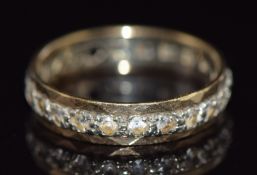A 9ct gold eternity ring set with paste, 2.7g, size P